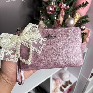 Coach Metallic Pink Wristlet with Pearl Lace Bow